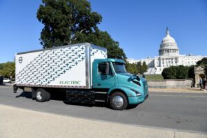 An electric truck in front of the United States Capitol